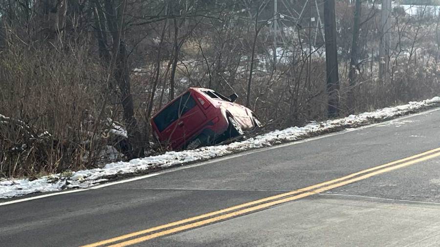 car-ends-up-between-tree-and-pole-in-lowellville