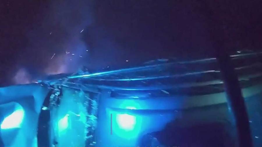 watch:-local-police-officers-help-save-driver-from-car-fire