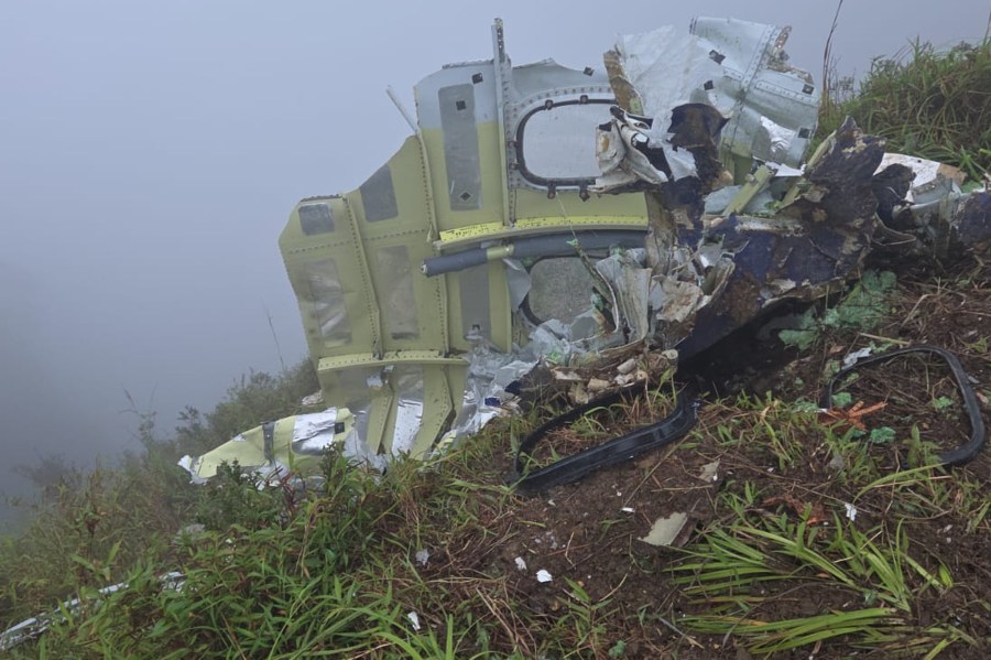 indonesian-rescuers-find-a-body-and-wreckage-of-plane-in-mountainous-region