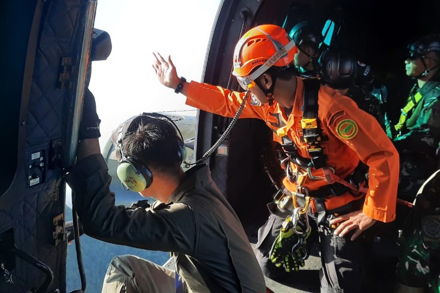 indonesian-rescuers-find-a-body-near-wreckage-of-a-plane-that-crashed-with-11-aboard
