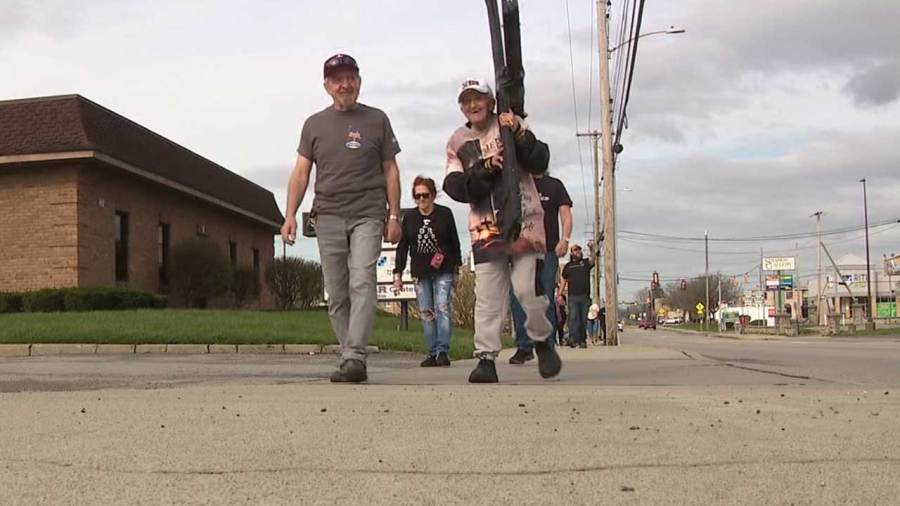 local-church-members-carry-cross-through-streets-on-good-friday