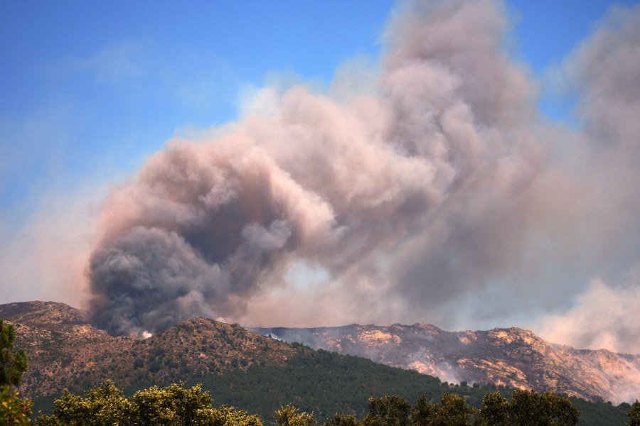 more-than-200,000-people-flee-raging-wildfires-in-france-and-spain,-some-escaping-by-boat