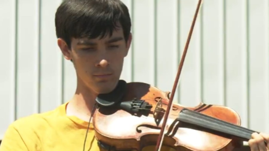 violinist-playing-to-bring-the-community-together