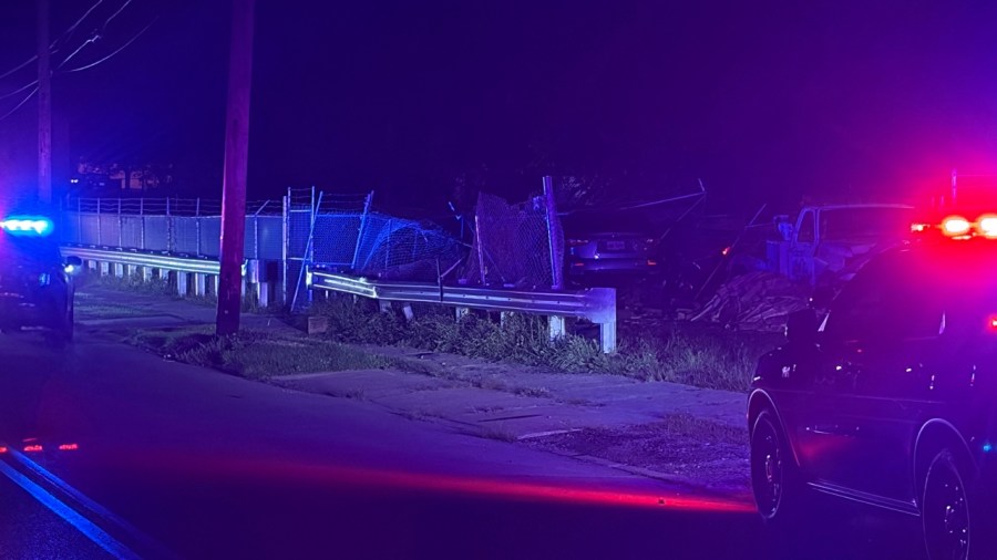 police:-car-plows-through-auto-service-lot,-driver-flees