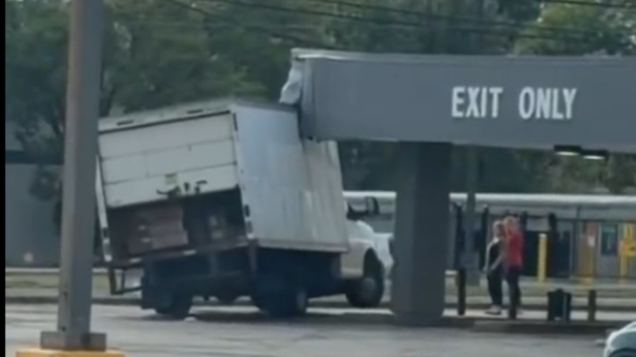 driver-cited-after-vehicle-gets-stuck-under-bank-awning