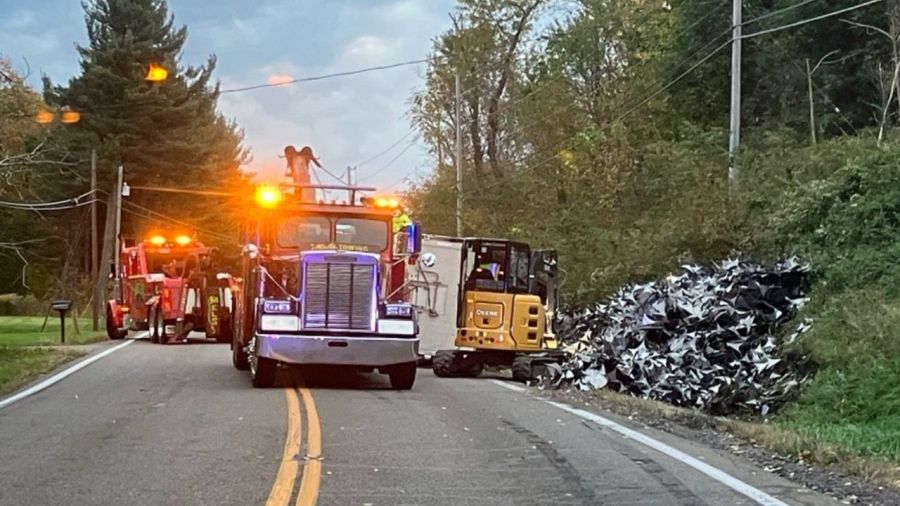 truck-hauling-scrap-metal-rolls-over,-closes-road-in-center-township