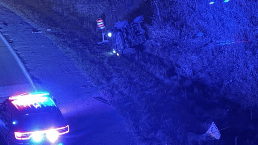 car-flips-on-side,-closes-road